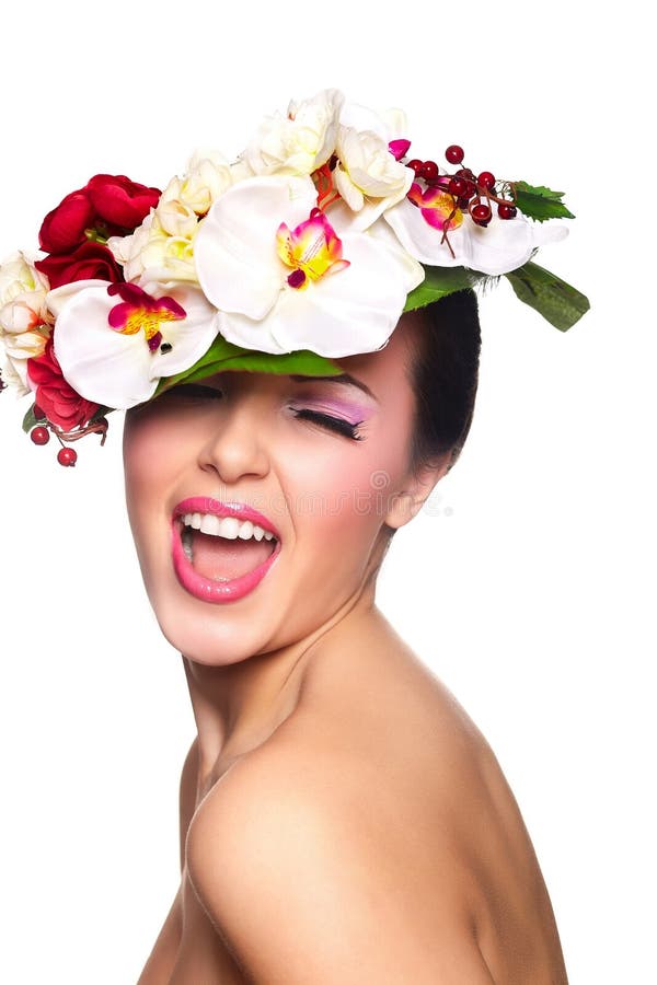 Beautiful woman with colorful flowers on head