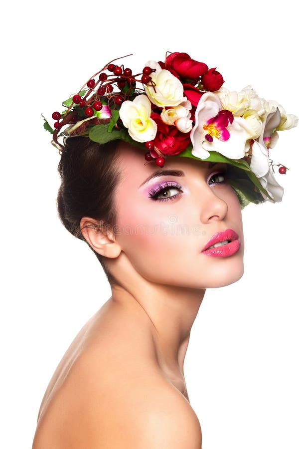 Beautiful woman with colorful flowers on head