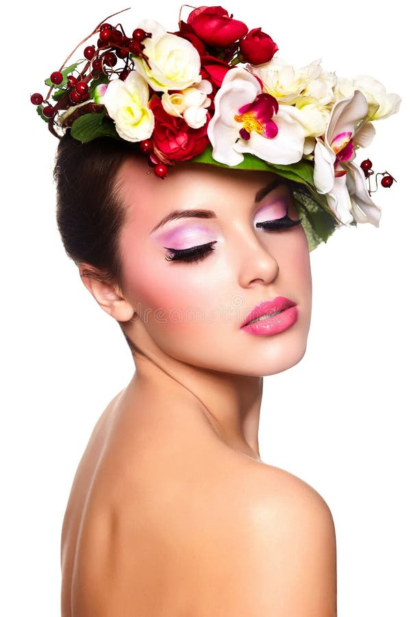 Beautiful woman with colorful flowers on head