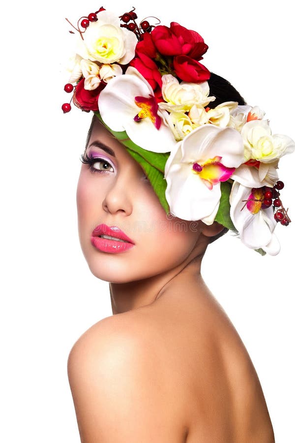 Beautiful woman with colorful flowers on head