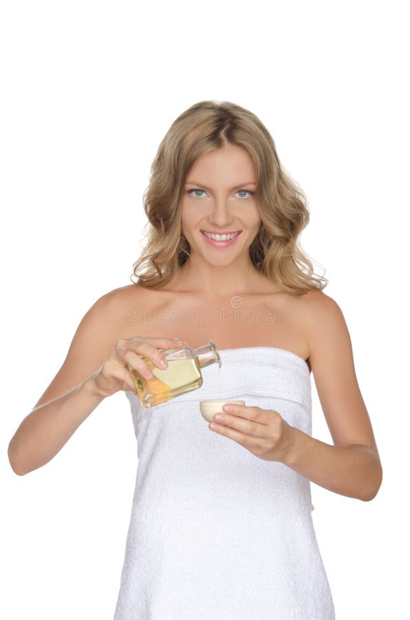 Beautiful woman with cosmetic oil royalty free stock images Beautiful woman with cosmetic oil royalty free stock images