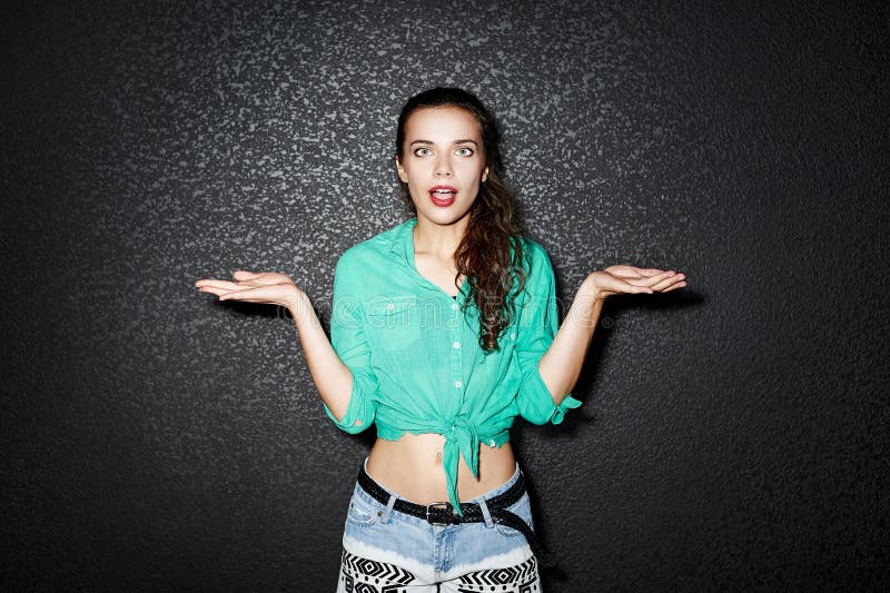 Beautiful woman with divorced hands making a choice. Studio fashion portrait