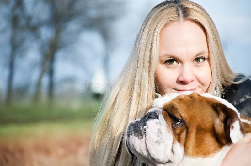 Beautiful woman with a dog stock photo. Image of color 25301066