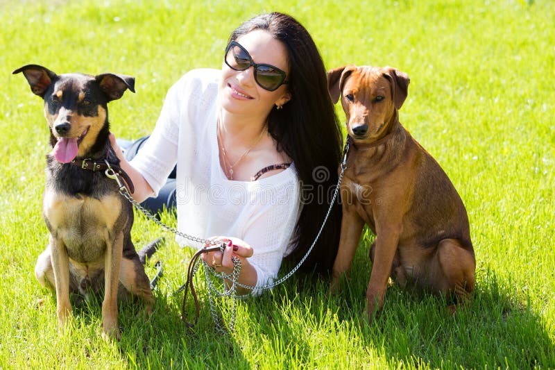 Beautiful woman with dogs