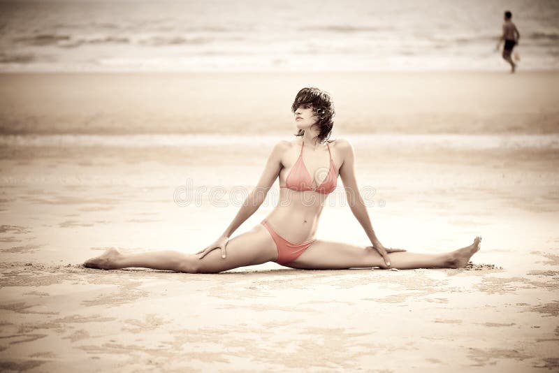 Beautiful woman doing stretches exercise