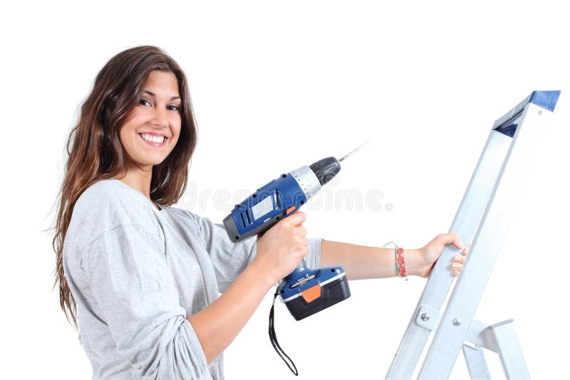 Beautiful woman with a drill on a ladder stock images