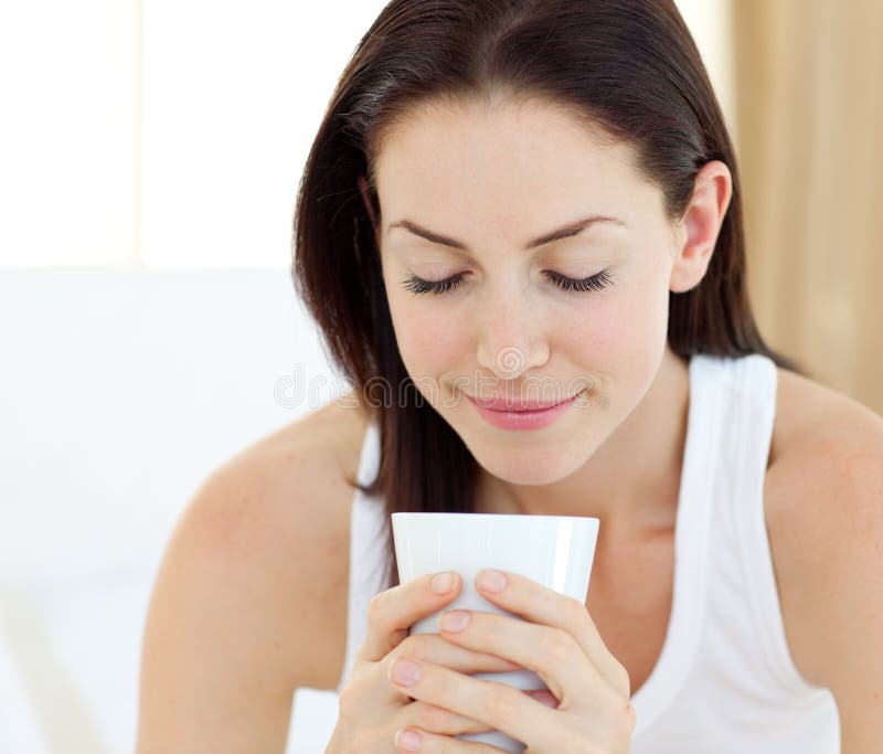 Beautiful woman drinking a coffee stock photo