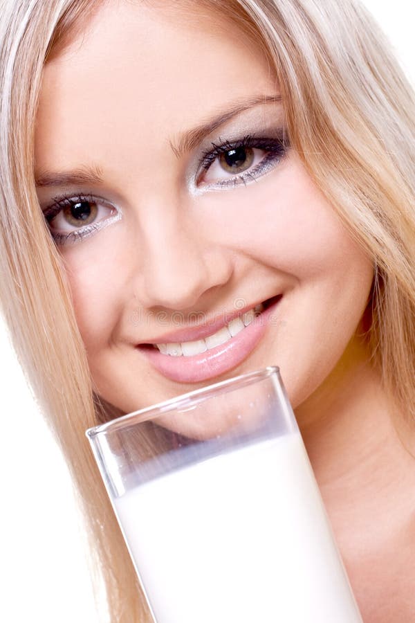 Beautiful woman drinking milk