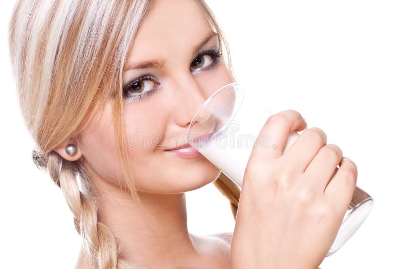 Beautiful woman drinking milk