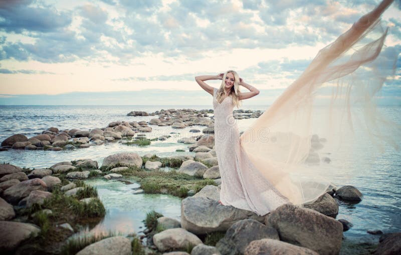 Beautiful Woman in Evening Gown, Sea and Cloudy Sky