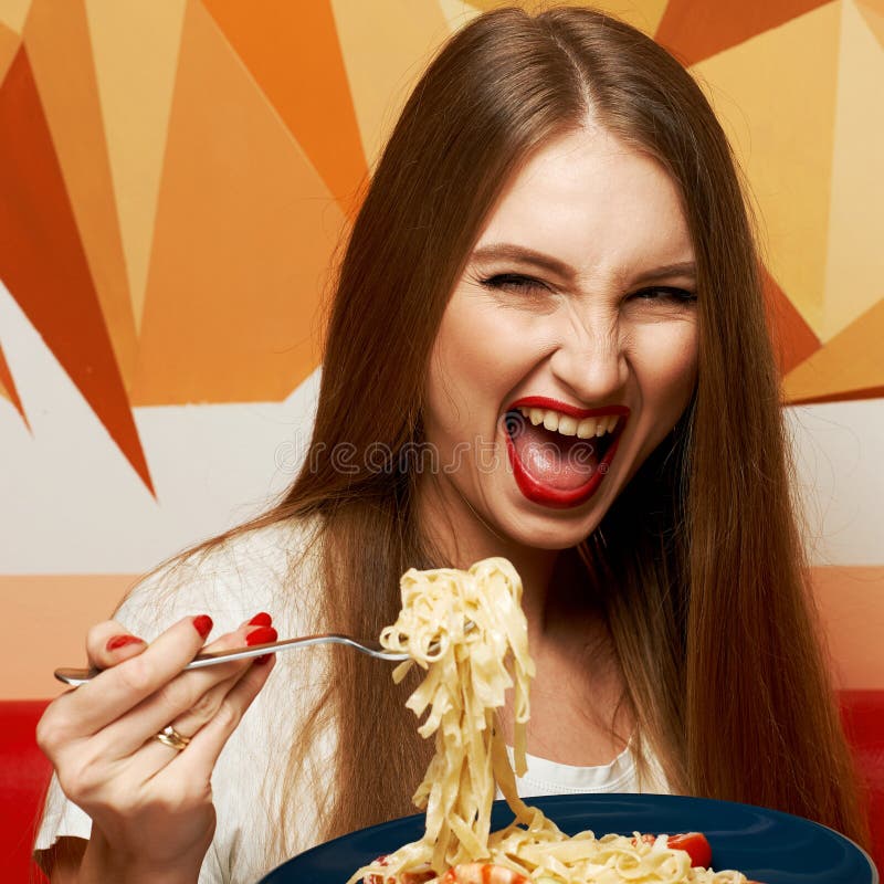 Beautiful Woman With Expressively Opened Mouth Eating Fettuccine Stock