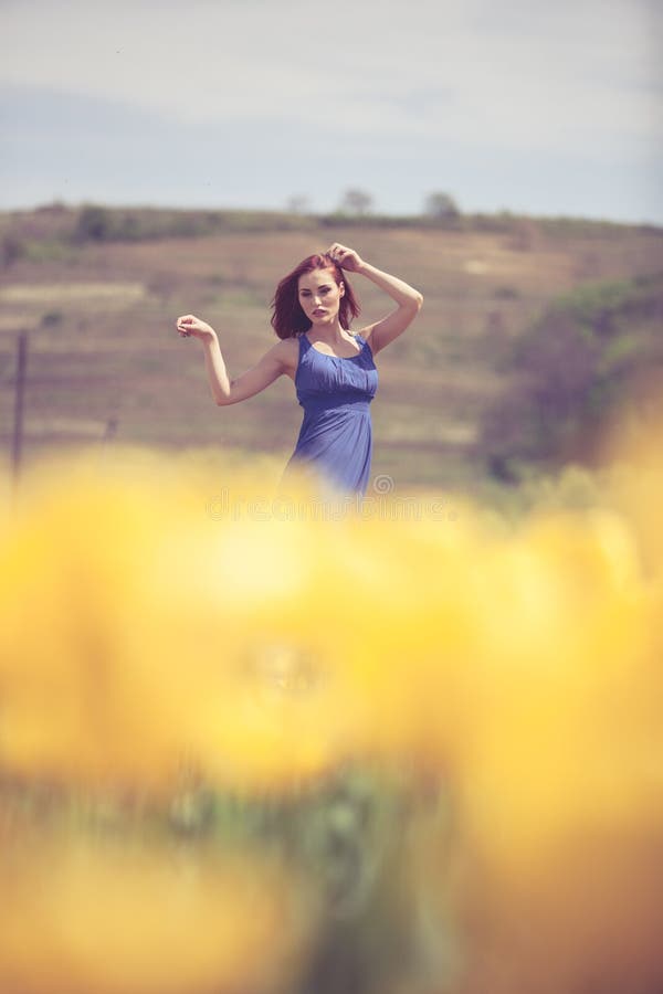 Beautiful Woman in Flower Field in Sunny Day Stock Photo - Image of ...