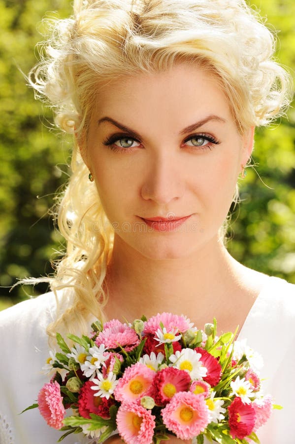 Beautiful Woman with Flowers Stock Image - Image of bunch, calm: 14511735