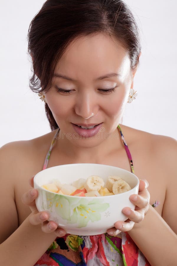 Beautiful woman and fruit salad