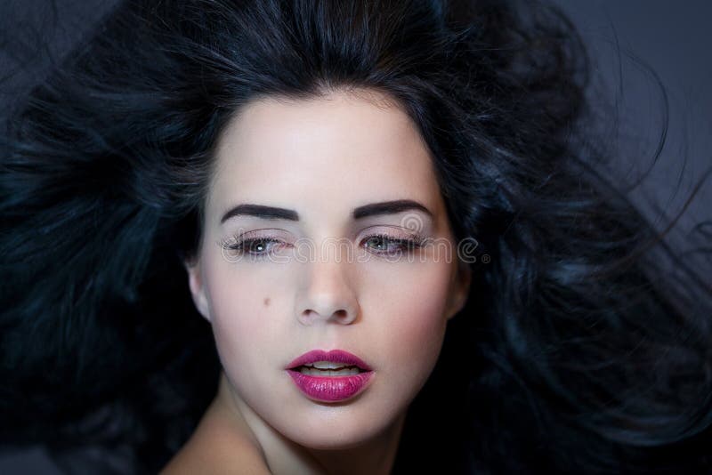 Beautiful woman with a gentle serene expression royalty free stock images Beautiful woman with a gentle serene expression royalty free stock images