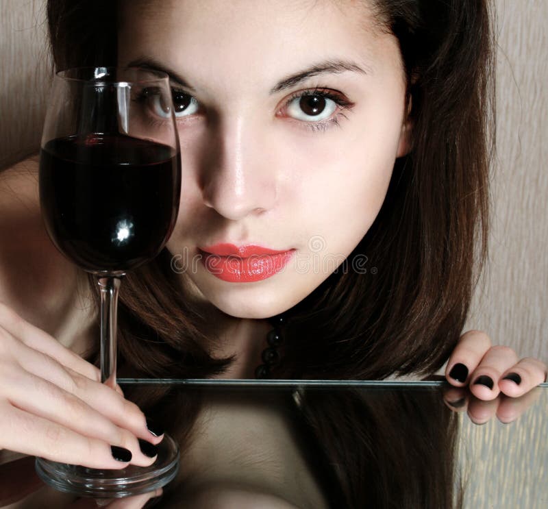 Beautiful woman with glass red wine