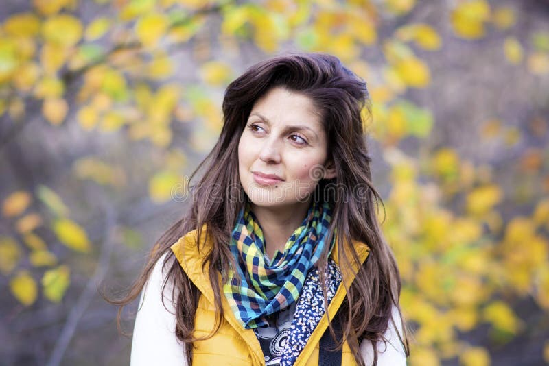 Beautiful woman in golden autumn park stock images Beautiful woman in golden autumn park stock images