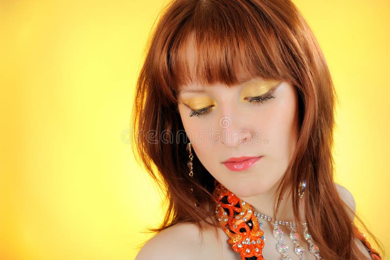 Beautiful woman with golden make-up