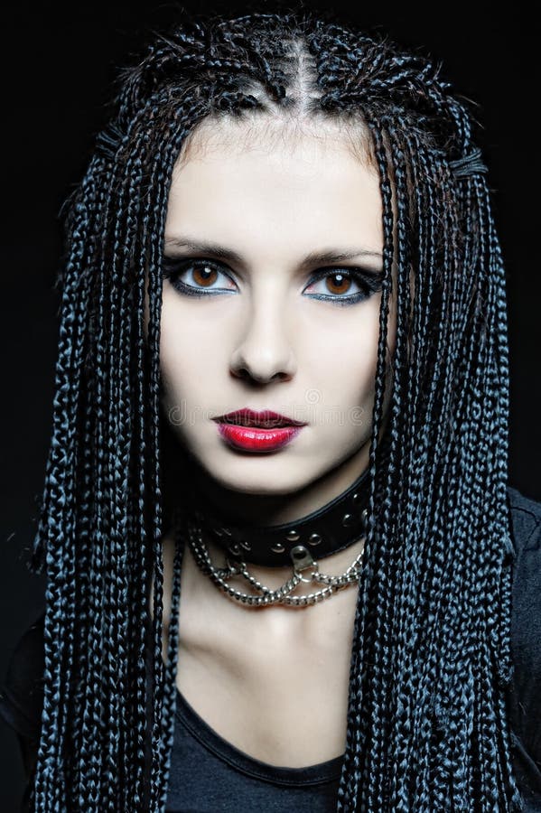 Beautiful woman in gothic shape with pigtails .