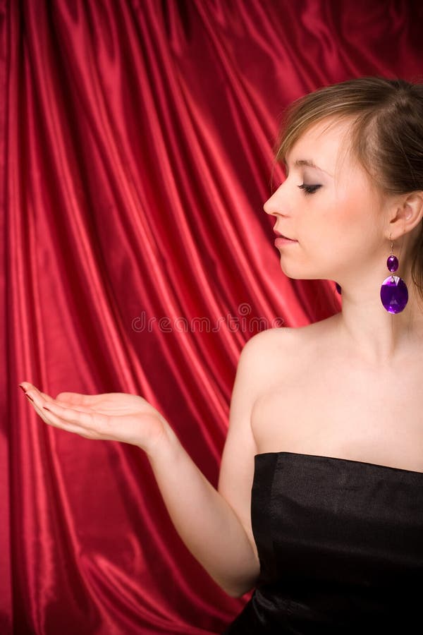 Beautiful woman with hand ready for product placement royalty free stock images