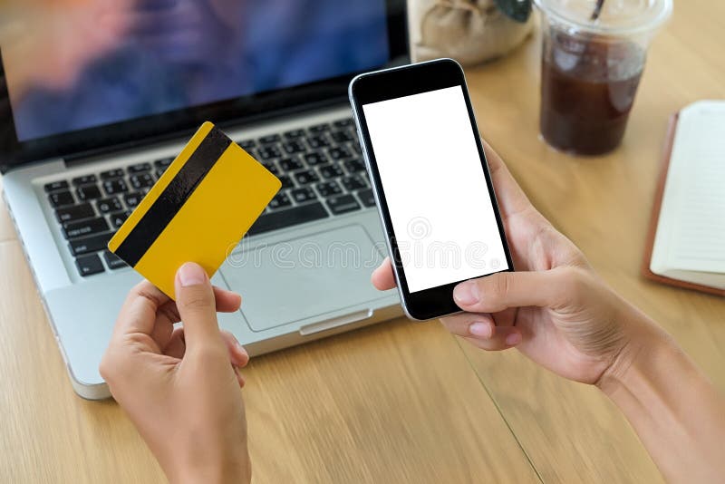 Beautiful woman hands holding a credit card