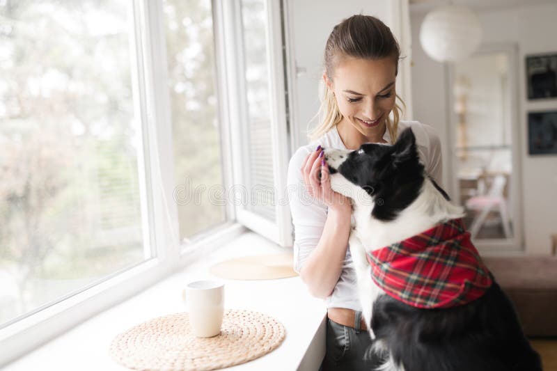 Beautiful woman happy while spending time with best friend , her royalty free stock image Beautiful woman happy while spending time with best friend , her royalty free stock image