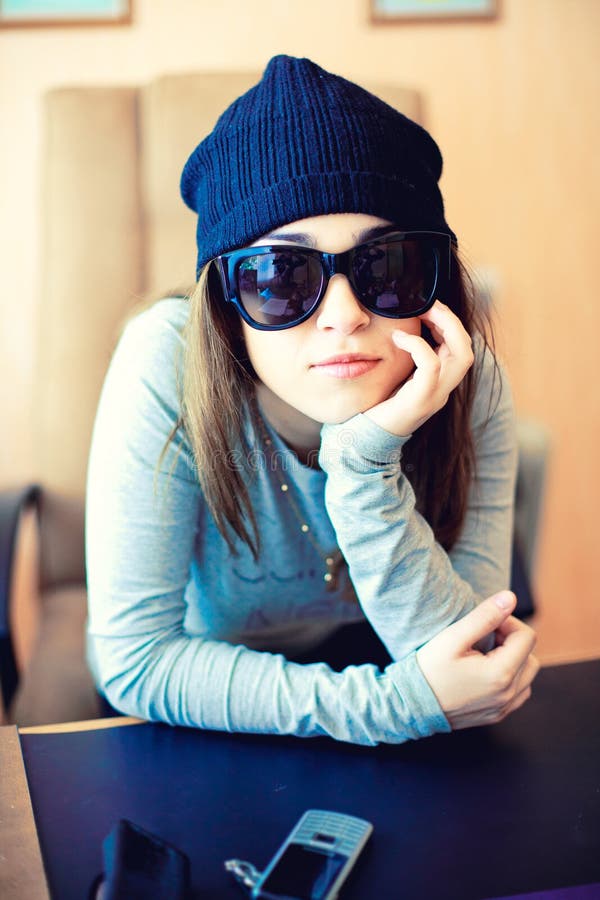 Beautiful woman in hat and sunglasses