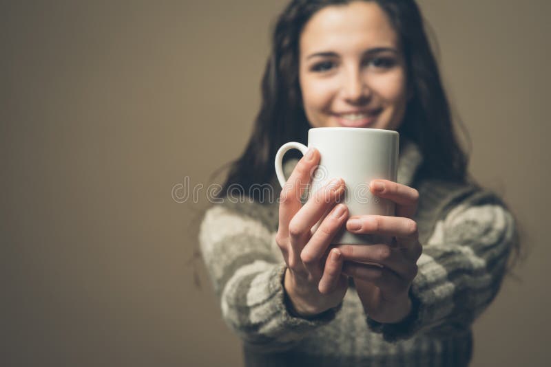 Beautiful woman having an hot drink