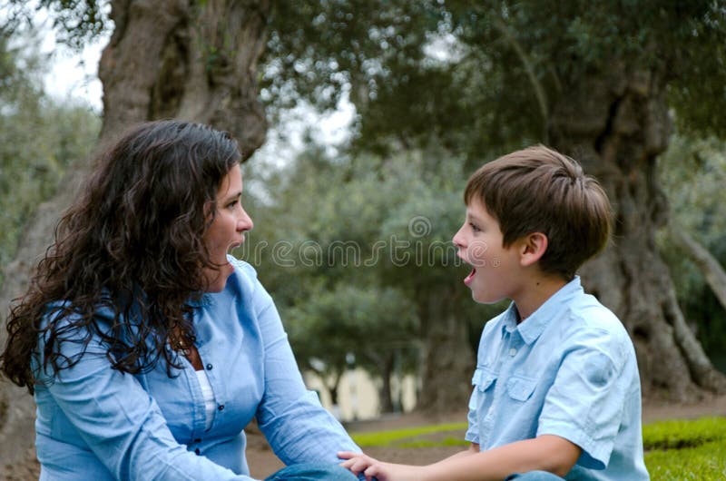 Beautiful woman and her cute little son looking to each other amazed royalty free stock images Beautiful woman and her cute little son looking to each other amazed royalty free stock images