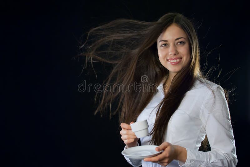 Beautiful woman holding cup of coffee
