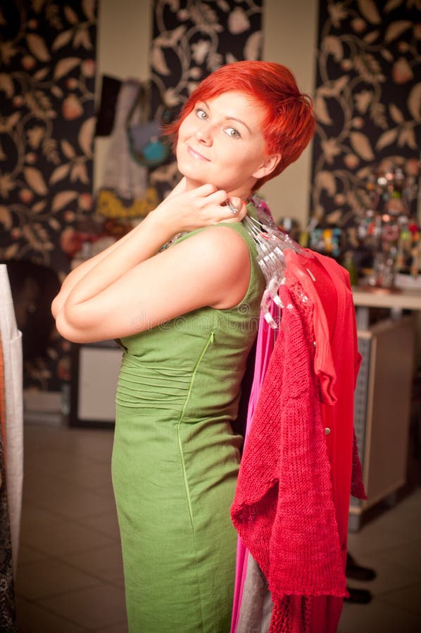 Beautiful woman holding a dress