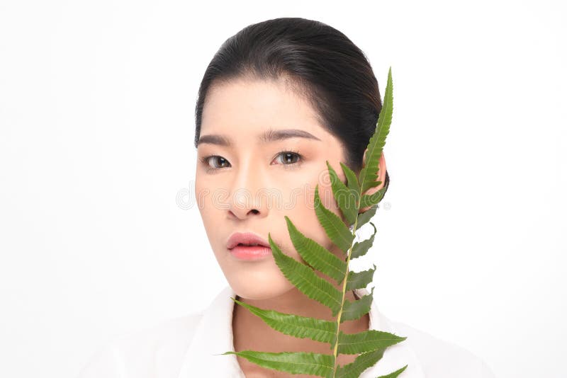 Beautiful woman holding green plant royalty free stock image Beautiful woman holding green plant royalty free stock image