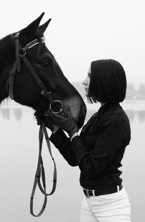 Beautiful woman with horse in black and white