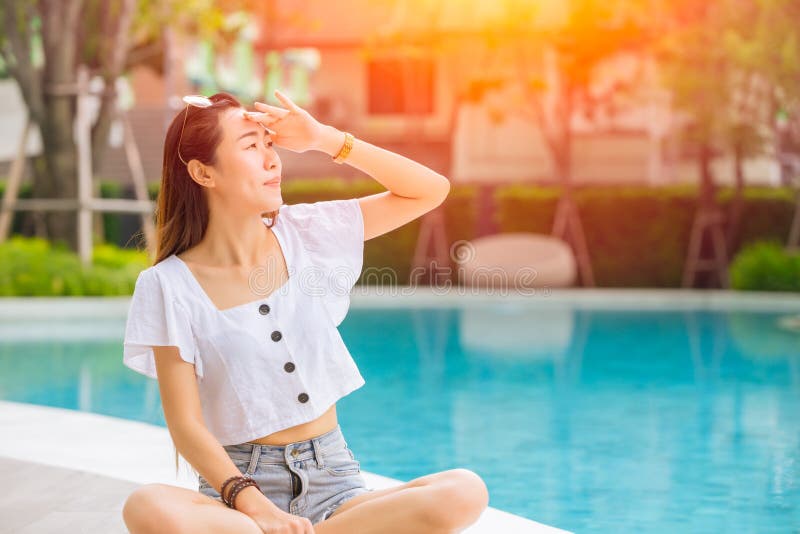 Beautiful woman with hot sunshine in summer sky for skin care and UV sun block Asian people beauty concept stock photos Beautiful woman with hot sunshine in summer sky for skin care and UV sun block Asian people beauty concept stock photos