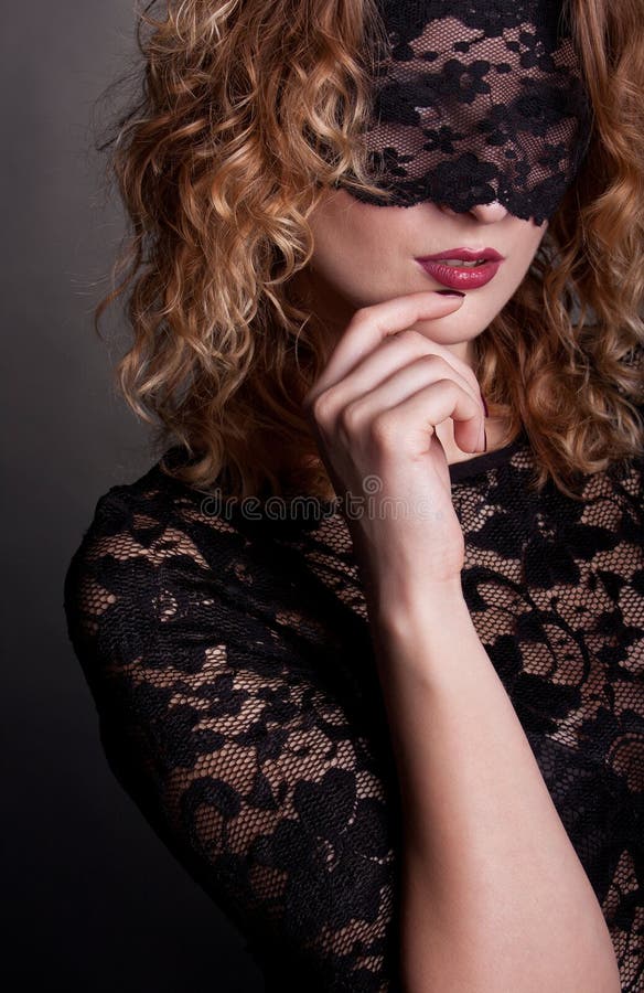 Beautiful woman with lace mask