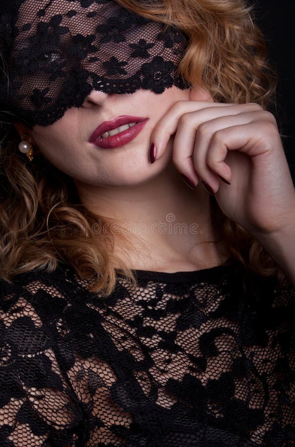 Beautiful woman with lace mask