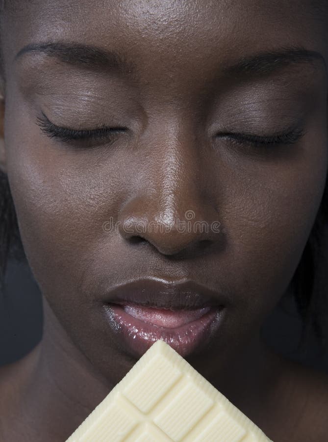 Beautiful woman with a large bar of choccolate