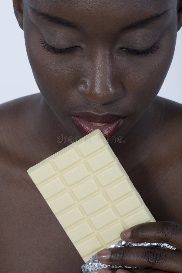 Beautiful woman with a large bar of choccolate