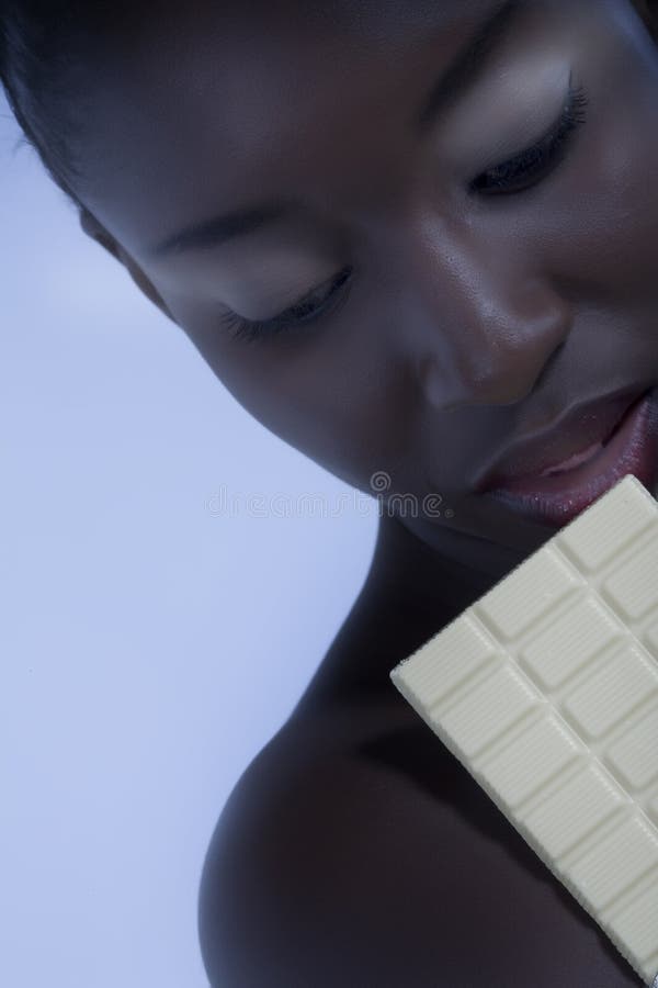 Beautiful woman with a large bar of choccolate