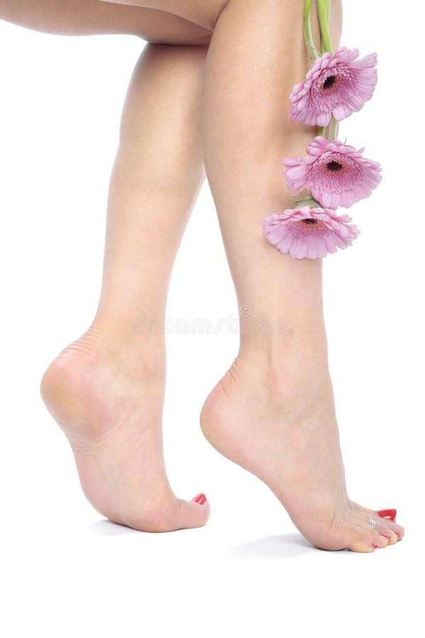 Beautiful woman legs and feet with flowers