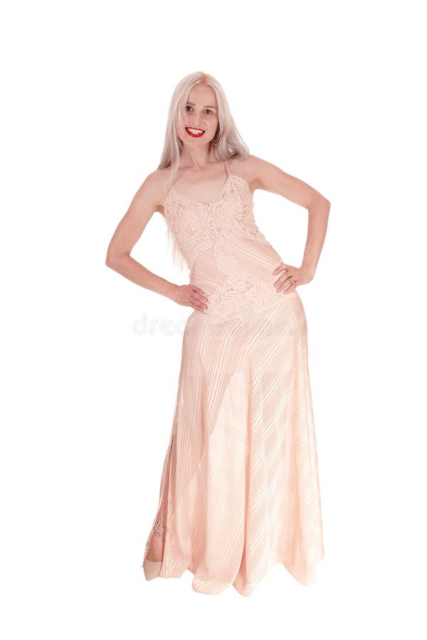 Beautiful woman in light pink evening dress