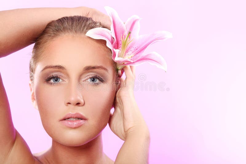 Beautiful woman with lily flower