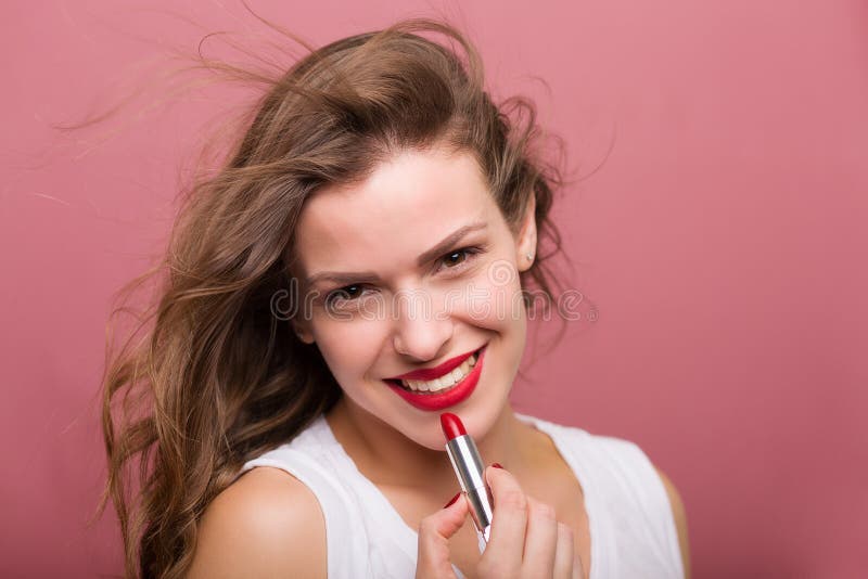 Beautiful Woman with a Lipstick Stock Photo - Image of care, brown ...