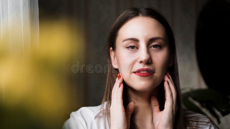 Beautiful woman with long brown straight hairs and red nails stock photography Beautiful woman with long brown straight hairs and red nails stock photography