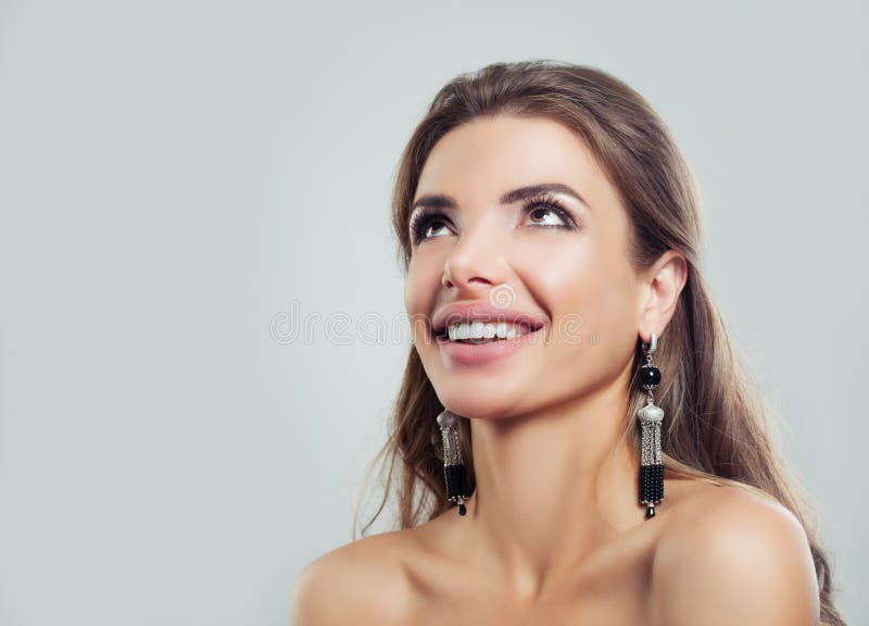 Beautiful Woman Looking Up and Laughing. Happy Fashion Model