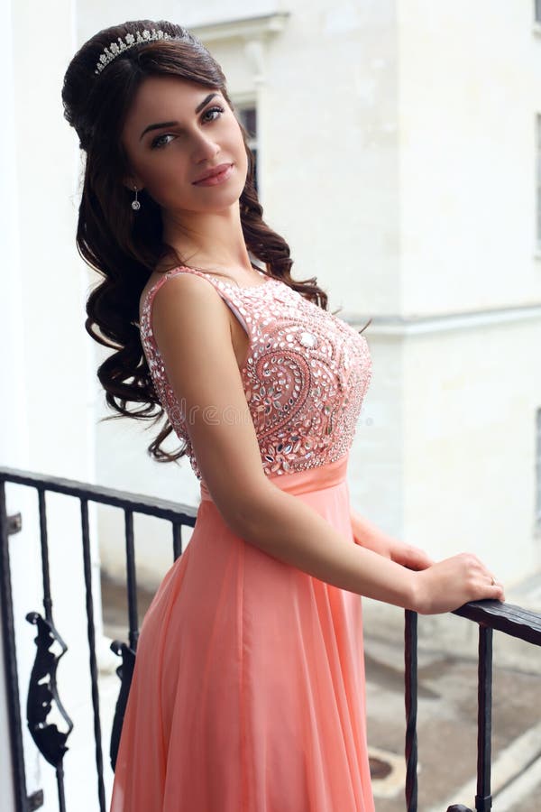 Beautiful Woman in Luxurious Dress Posing on Balcony Stock Image ...