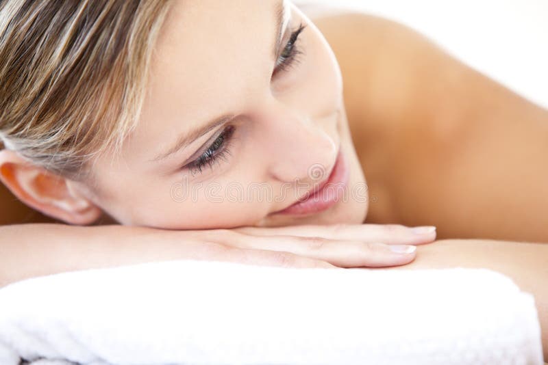 Beautiful woman lying on a massage table royalty free stock photo