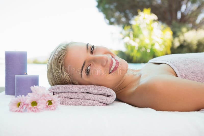 Beautiful Woman Lying On Massage Table At Spa Center Stock Image