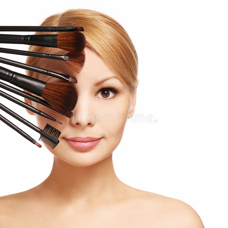 Beautiful woman with makeup brushes near attractive face royalty free stock photos Beautiful woman with makeup brushes near attractive face royalty free stock photos