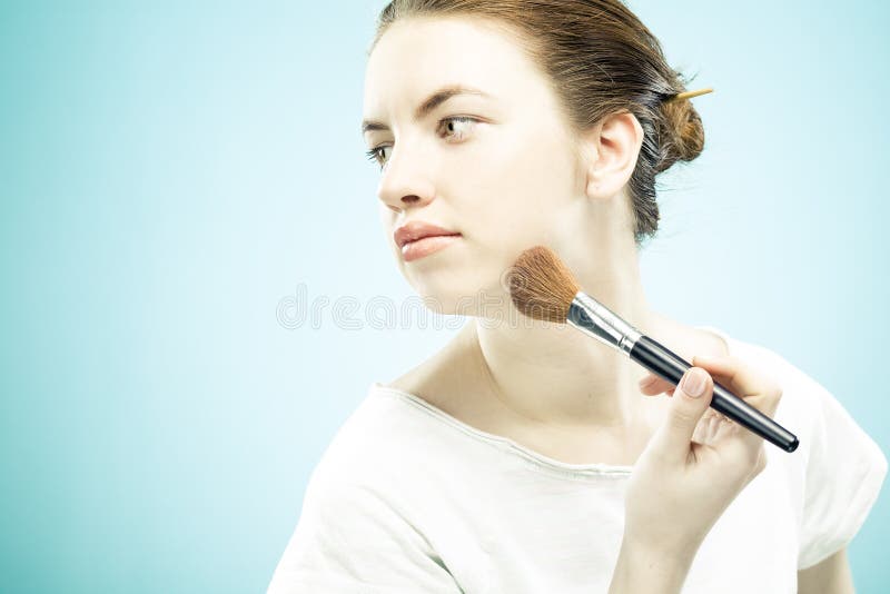 Beautiful woman making make-up